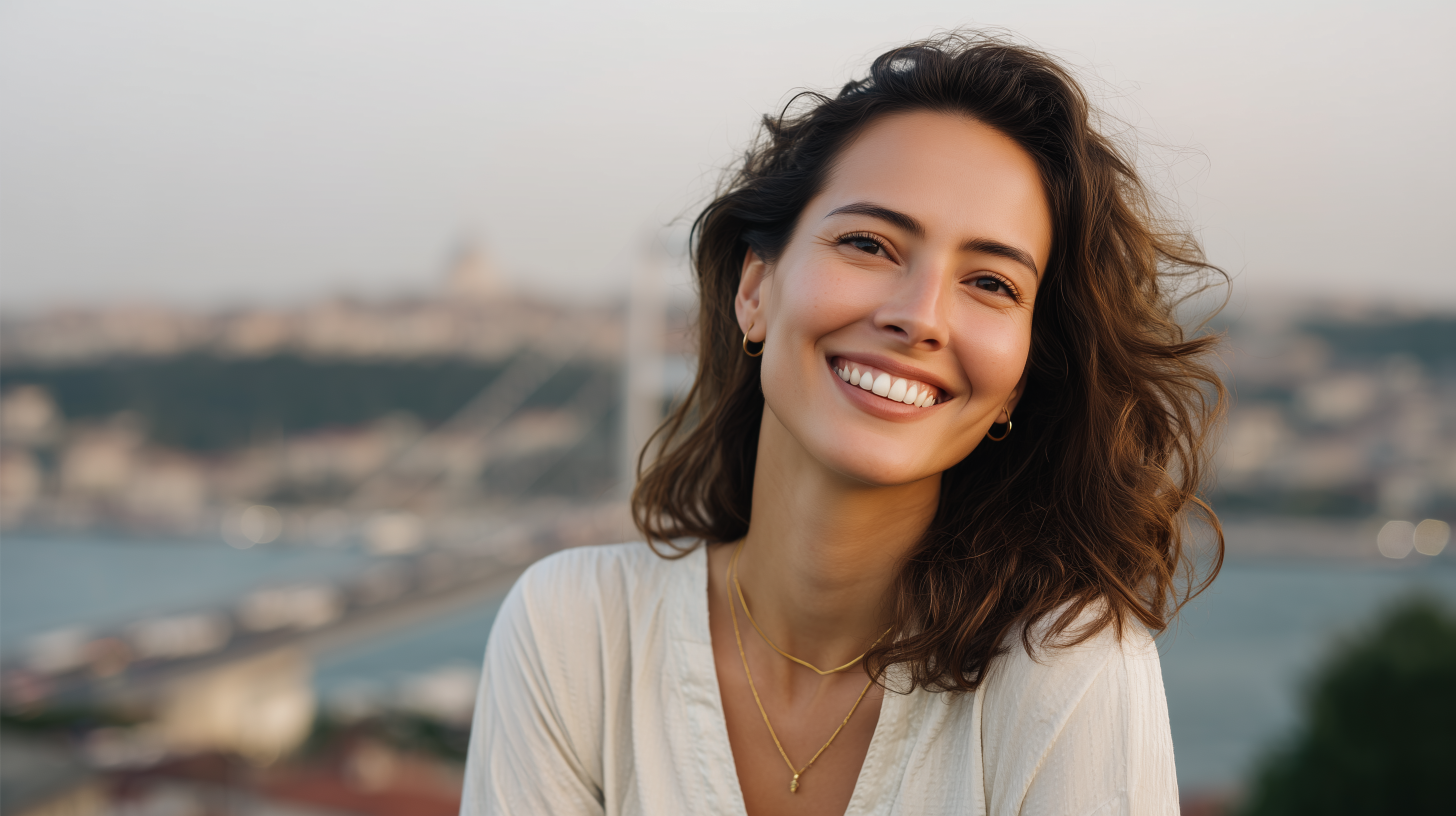 Smiling woman with composite veneers with Istanbul view behind