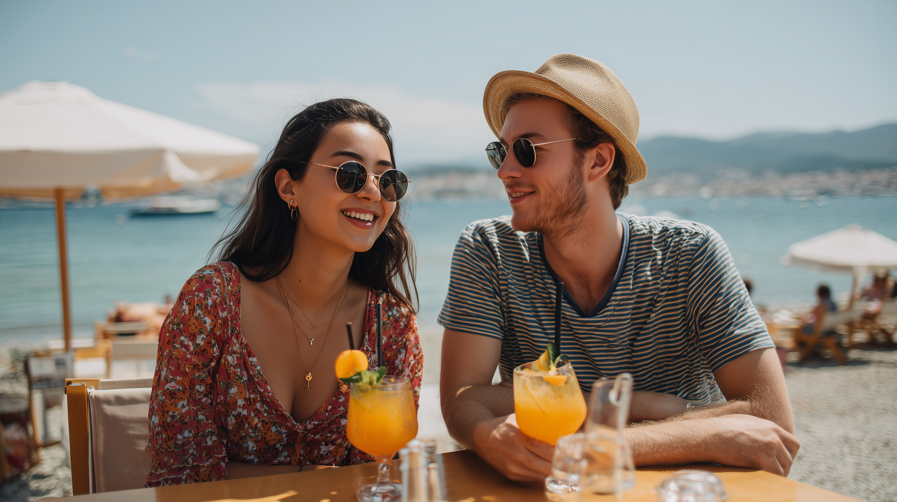 A couple drinking cocktails and relaxing on a beach in Izmir